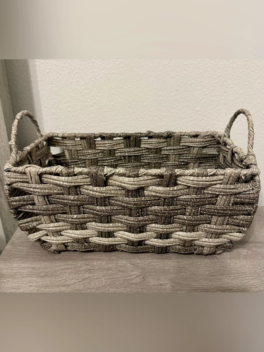 Allen +Roth . This small, grey decorative basket by allen + roth is made of poly